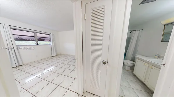 a bathroom with a shower and a sink