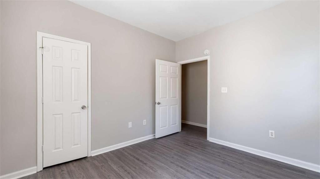 848 Ridge Avenue Northwest, Unit A Atlanta, GA 30318 - Photo 14 of 26 a view of an empty room with wooden floor and closet