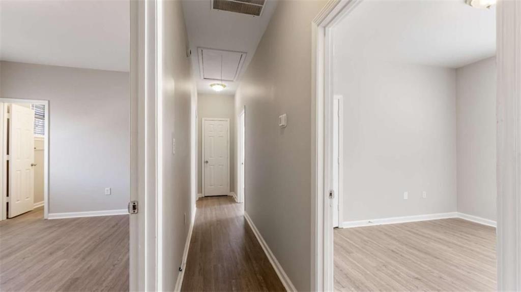 848 Ridge Avenue Northwest, Unit A Atlanta, GA 30318 - Photo 9 of 26 a view of a hallway with wooden floor