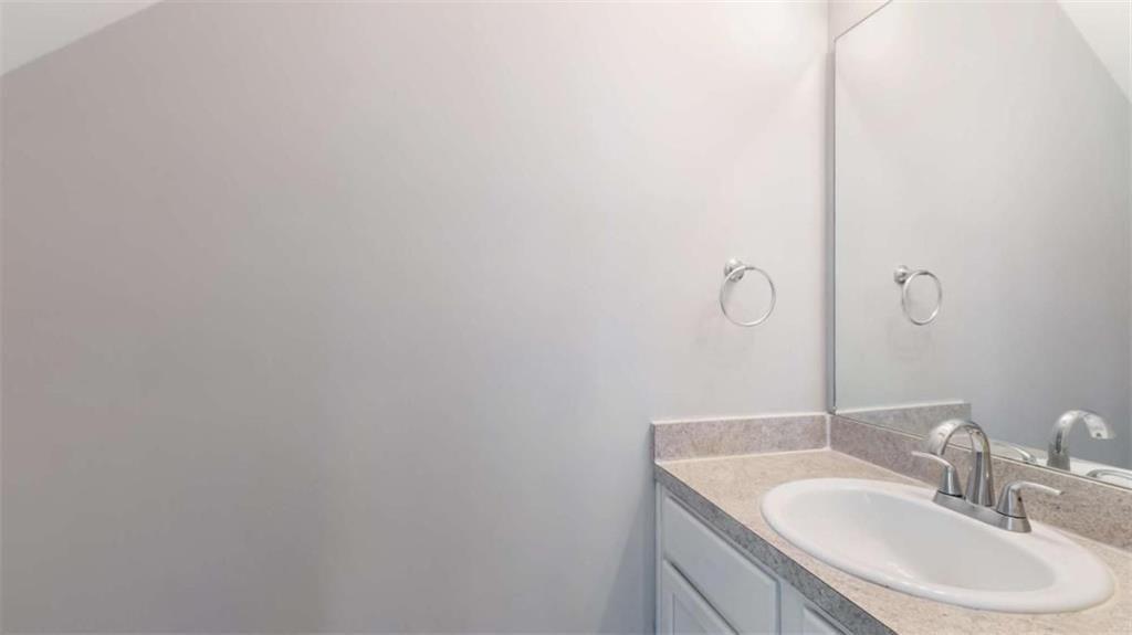 848 Ridge Avenue Northwest, Unit A Atlanta, GA 30318 - Photo 10 of 26 a bathroom with a sink and a mirror