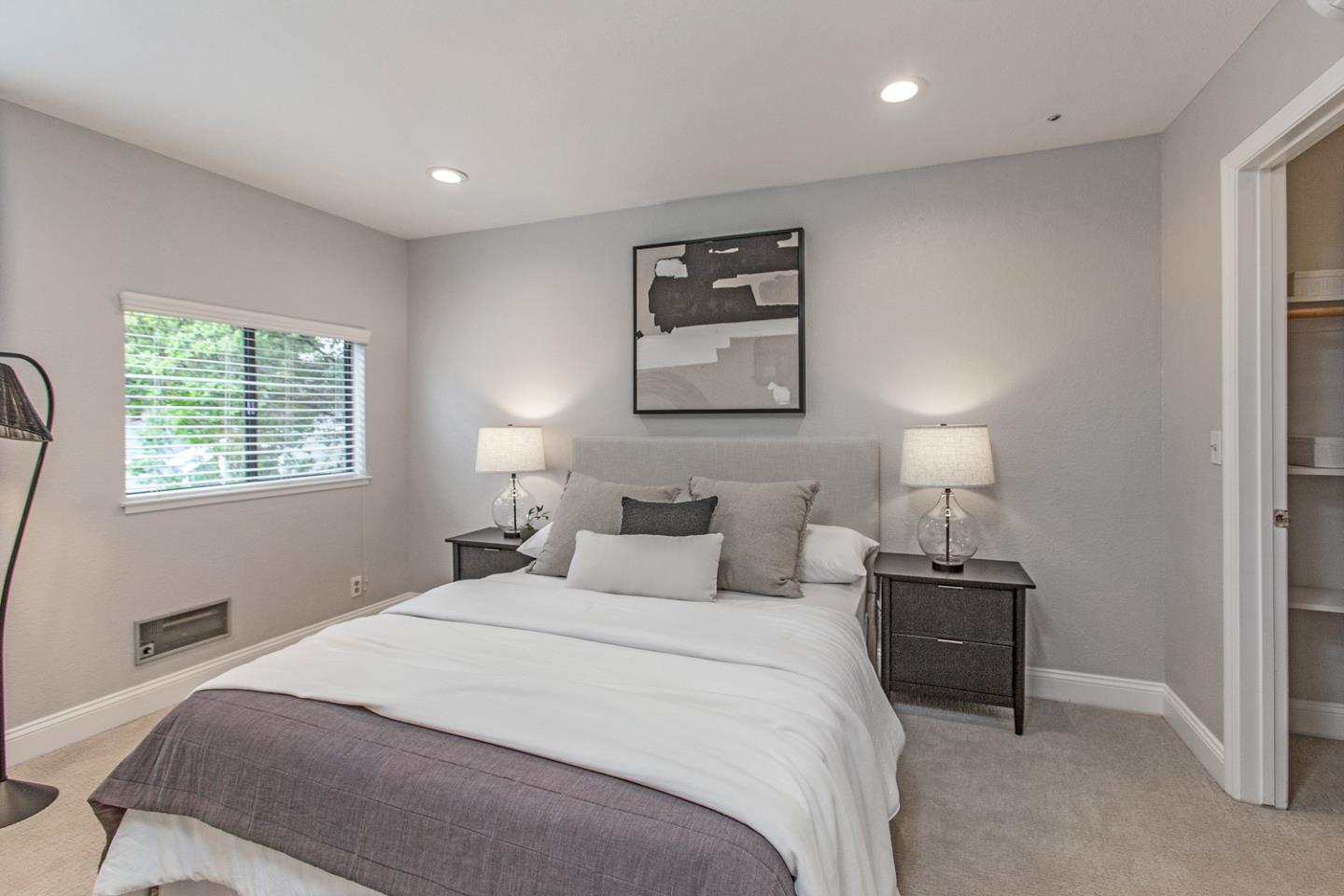 2080 Marich Way, Unit 8 Mountain View, CA 94040 - Photo 16 of 23 a bedroom with a bed and a night stand