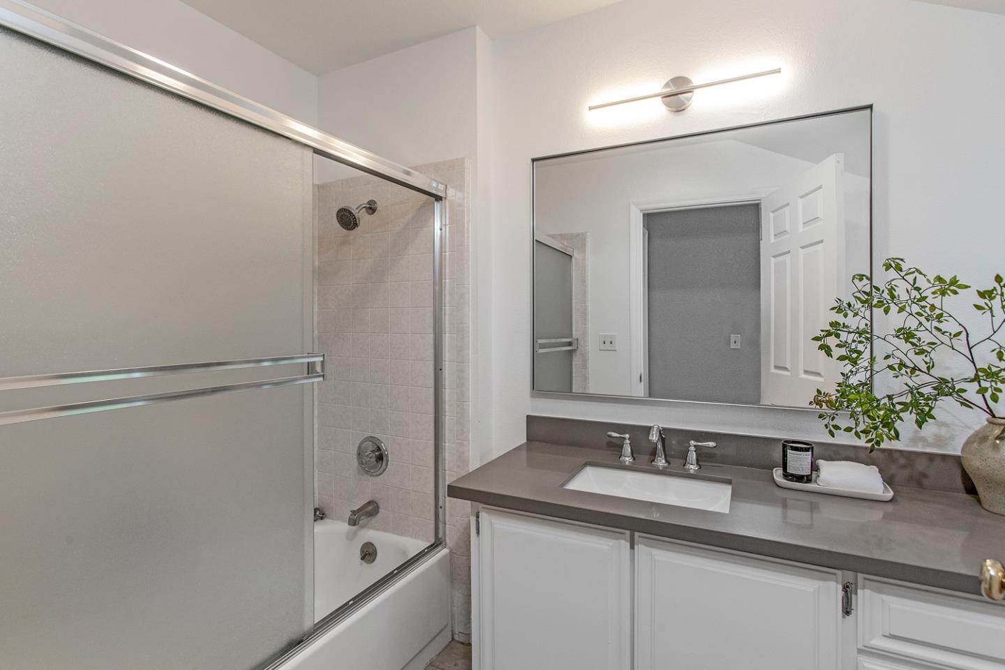 2080 Marich Way, Unit 8 Mountain View, CA 94040 - Photo 17 of 23 a bathroom with a sink and mirror with bathtub