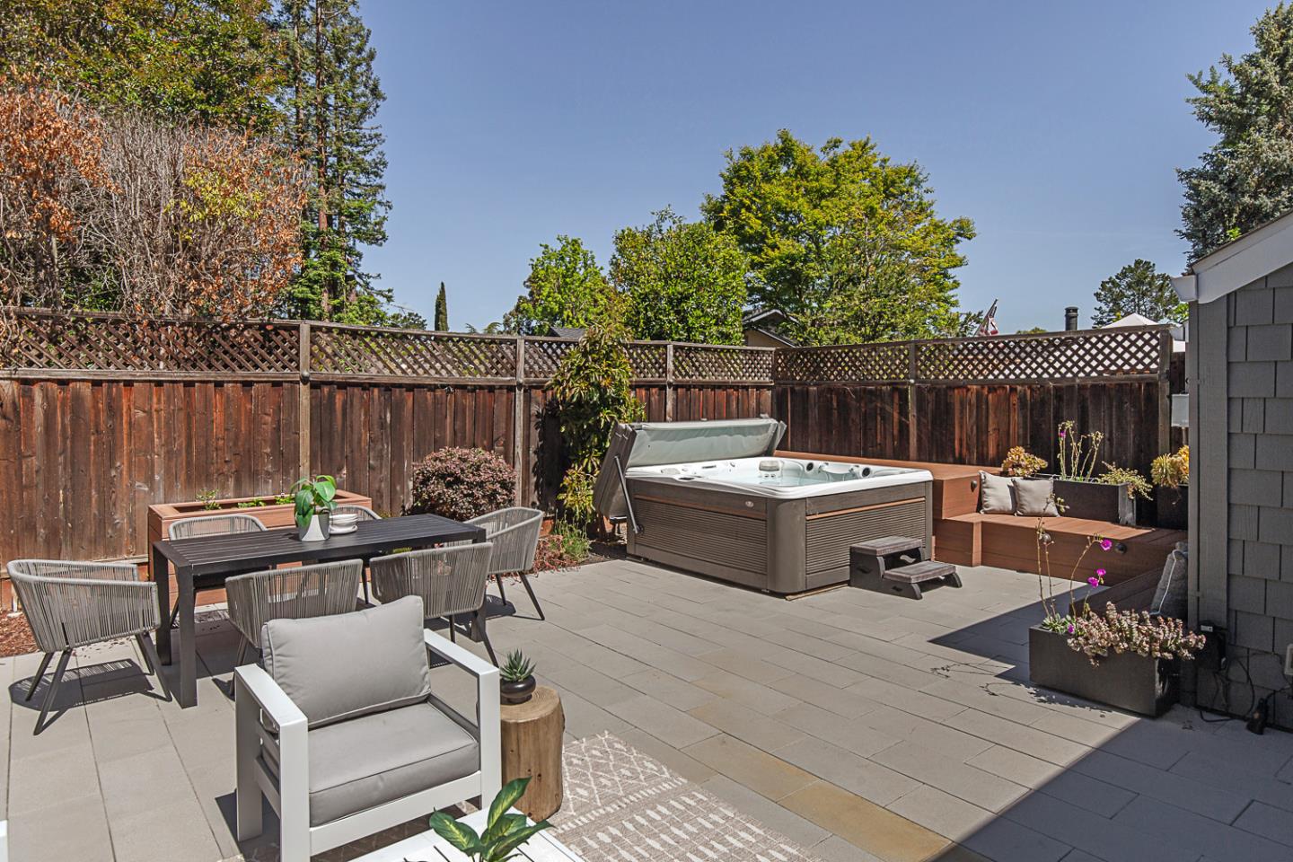 2080 Marich Way, Unit 8 Mountain View, CA 94040 - Photo 19 of 23 a view of a patio with table and chairs potted plants with wooden fence