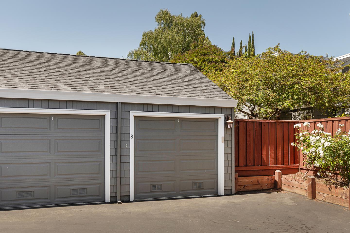 2080 Marich Way, Unit 8 Mountain View, CA 94040 - Photo 22 of 23 a view of a house with a door and wooden fence