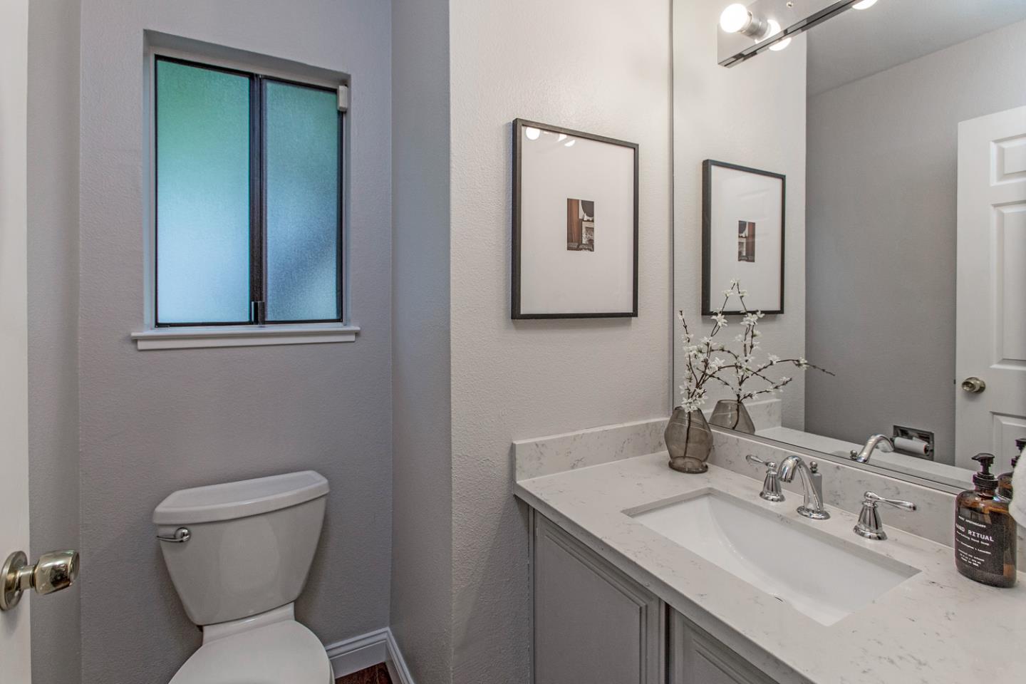 2080 Marich Way, Unit 8 Mountain View, CA 94040 - Photo 10 of 23 a bathroom with a toilet sink and mirror