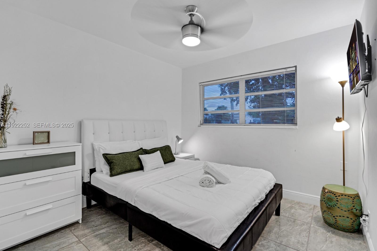 1165 Southwest 4th Terrace Pompano Beach, FL 33060 - Photo 25 of 42 a bedroom with a bed and a dresser