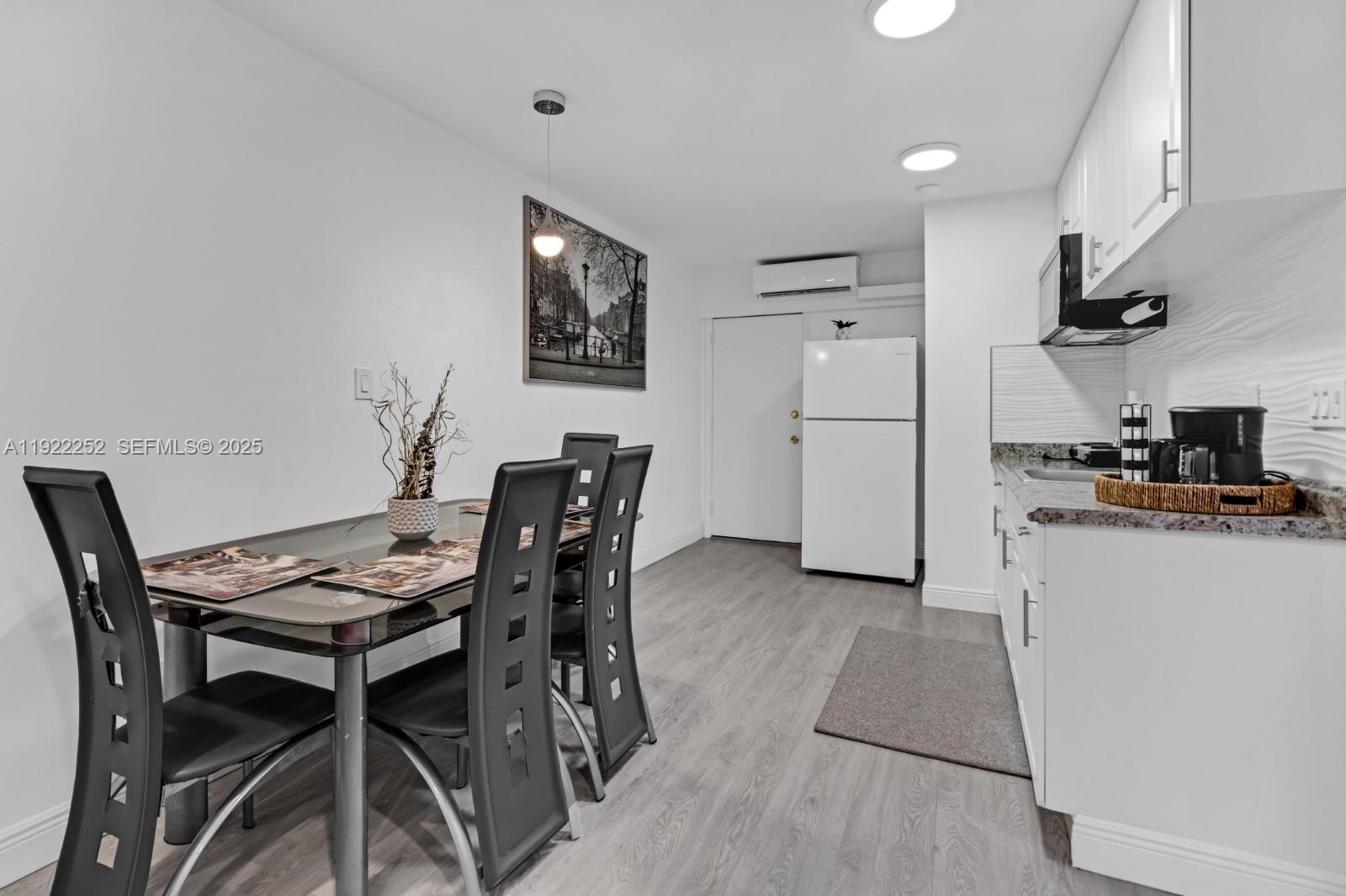 1165 Southwest 4th Terrace Pompano Beach, FL 33060 - Photo 33 of 42 a view of a dining room with furniture and wooden floor