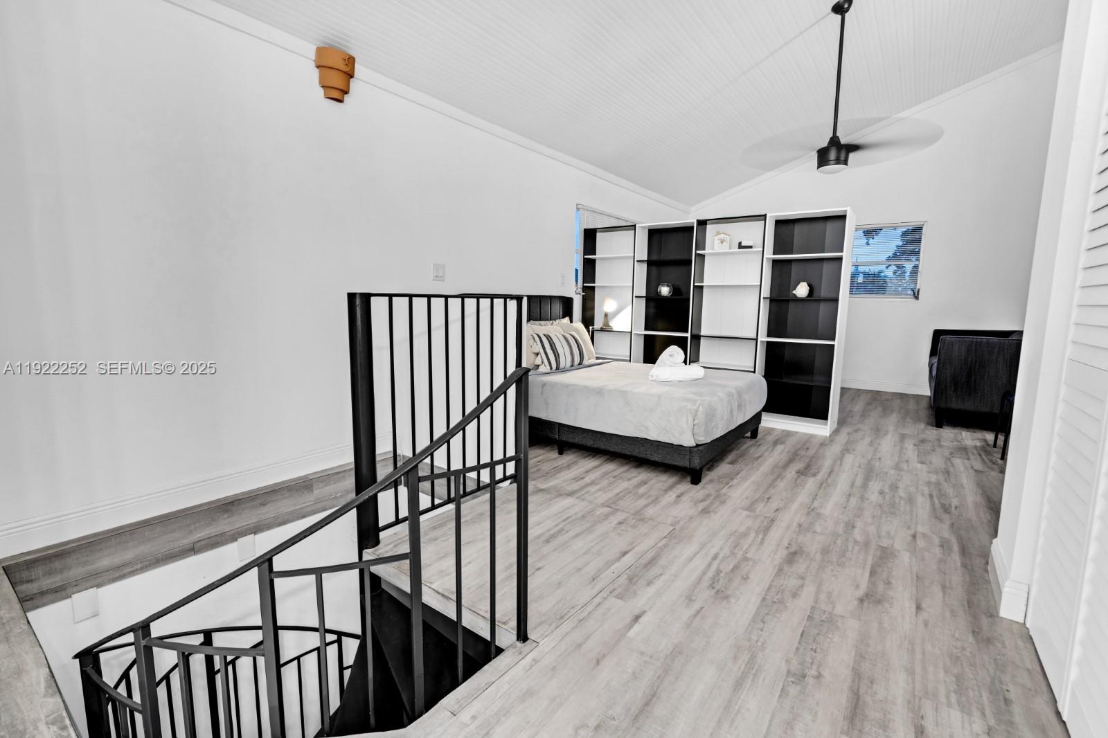 1165 Southwest 4th Terrace Pompano Beach, FL 33060 - Photo 36 of 42 a bedroom with furniture and wooden floor