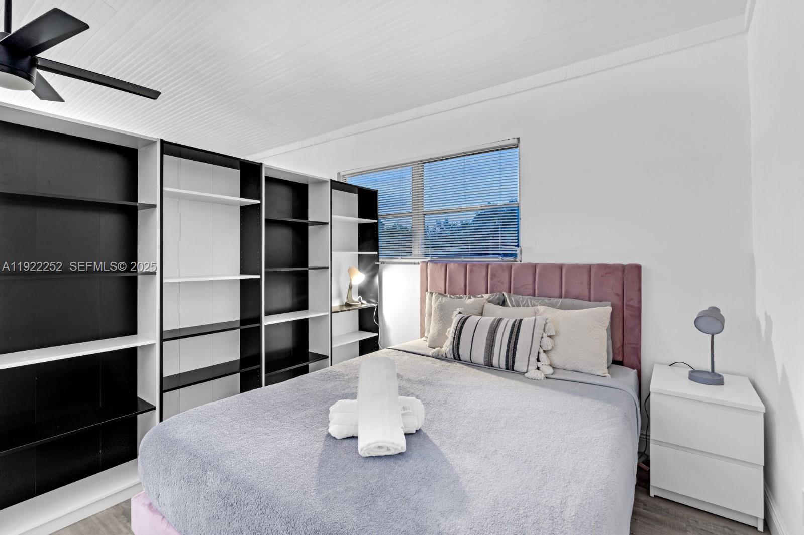 1165 Southwest 4th Terrace Pompano Beach, FL 33060 - Photo 38 of 42 a bedroom with a bed and a window