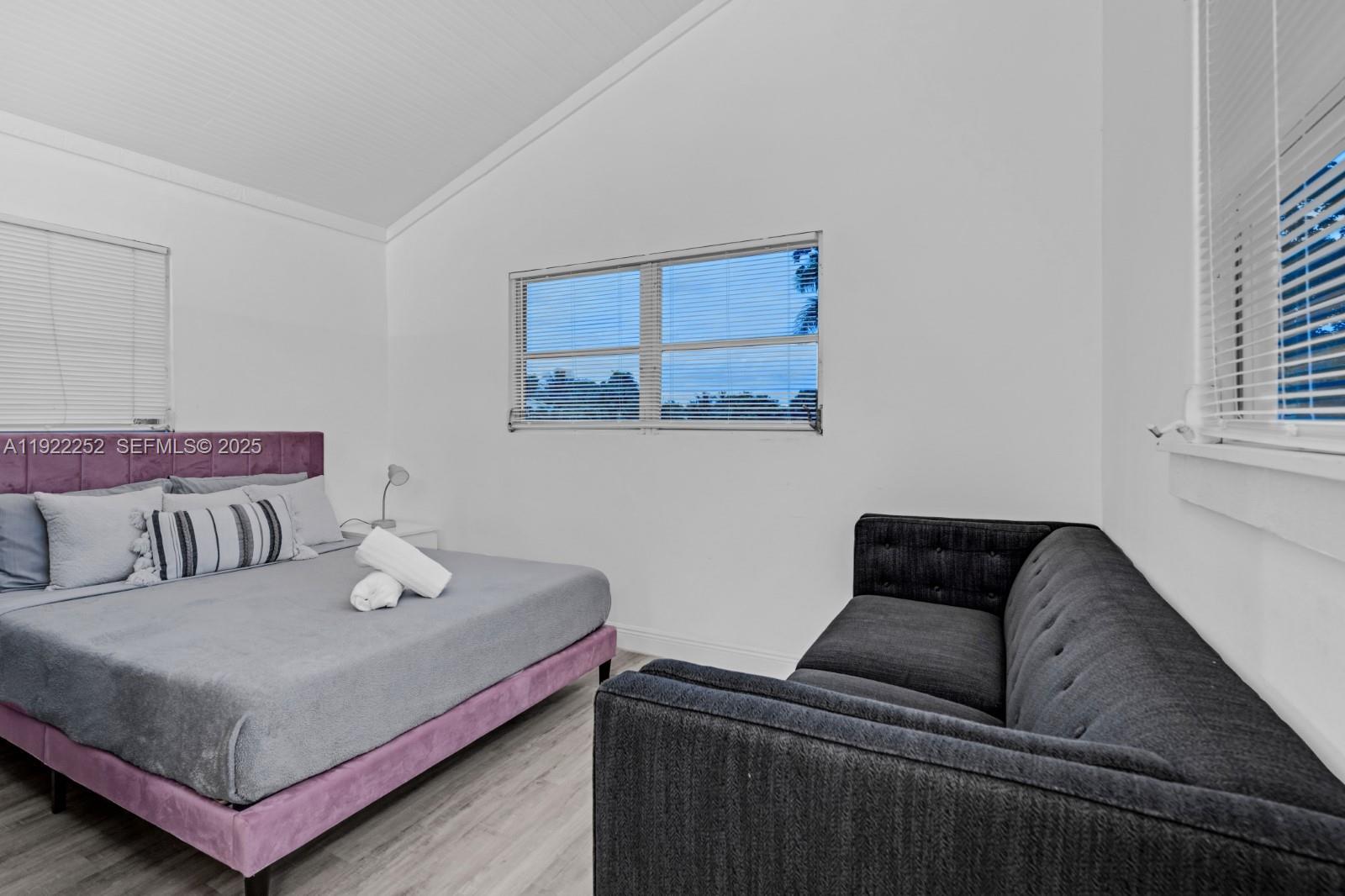 1165 Southwest 4th Terrace Pompano Beach, FL 33060 - Photo 40 of 42 a living room with furniture and a couch