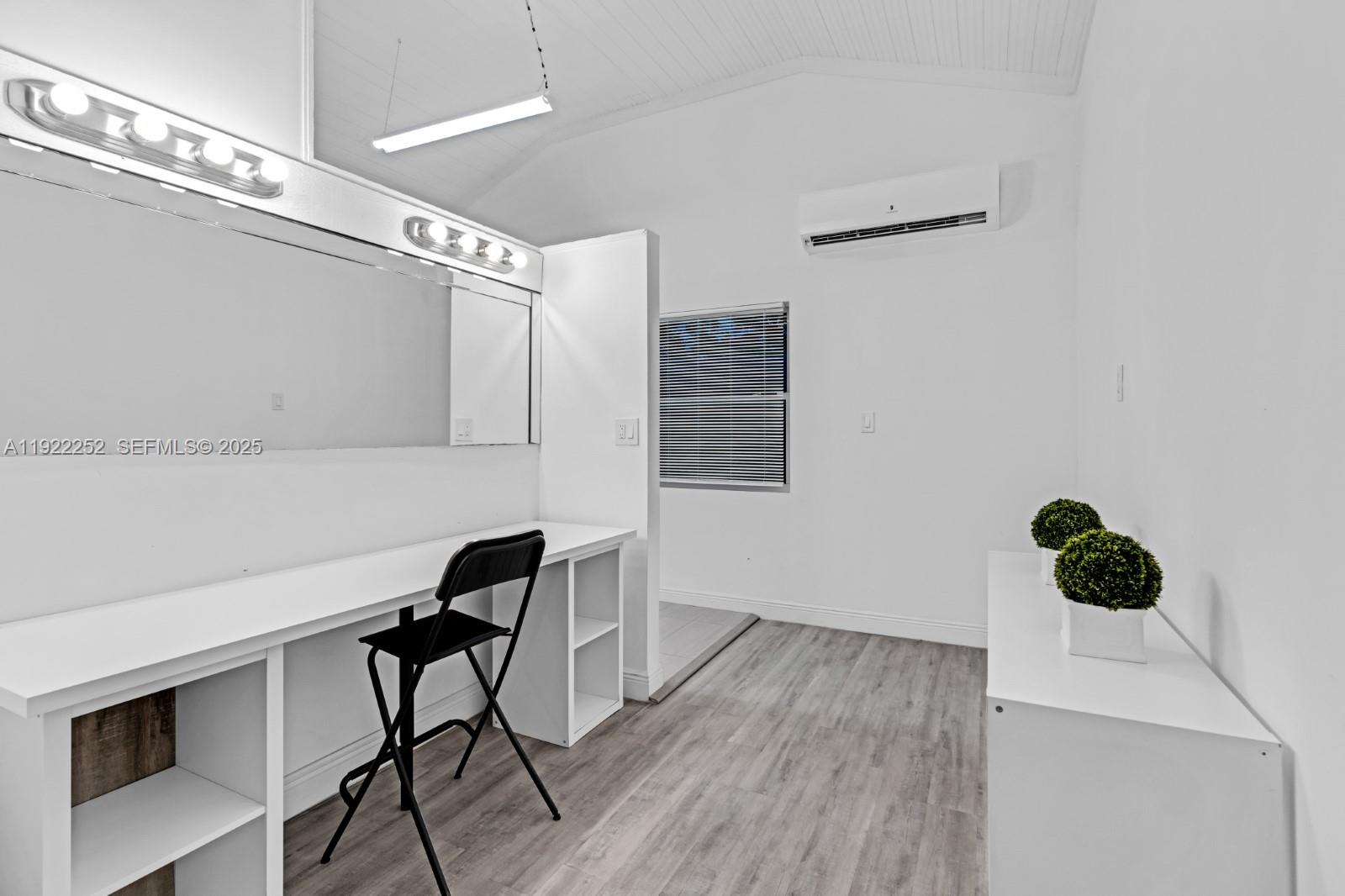 1165 Southwest 4th Terrace Pompano Beach, FL 33060 - Photo 41 of 42 a view of a workspace with furniture and wooden floor