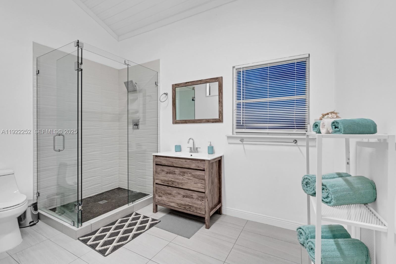 1165 Southwest 4th Terrace Pompano Beach, FL 33060 - Photo 42 of 42 a bathroom with a tub shower and sink