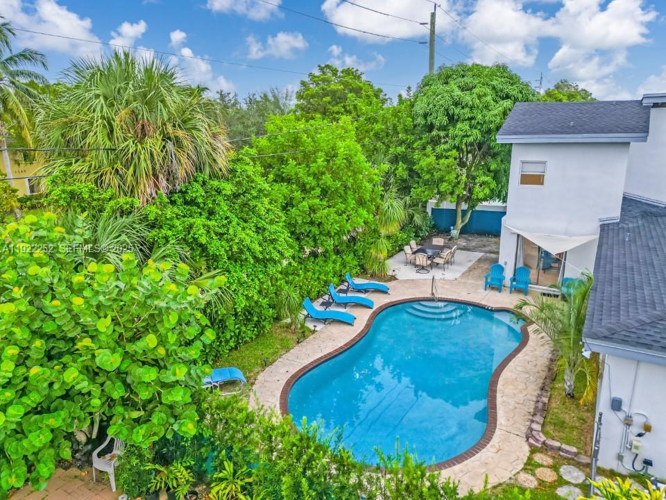 1165 Southwest 4th Terrace Pompano Beach, FL 33060 - Photo 9 of 42 view of a house with a yard and sitting area