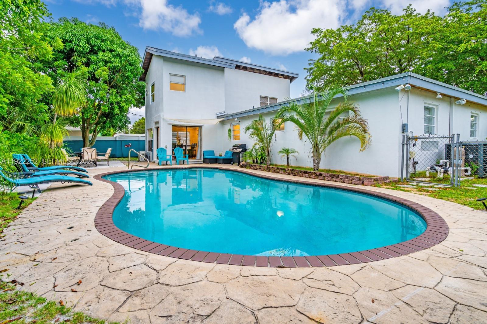 1165 Southwest 4th Terrace Pompano Beach, FL 33060 - Photo 10 of 42 a view of a house with swimming pool