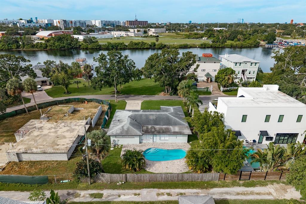 an aerial view of residential house with outdoor space and lake view