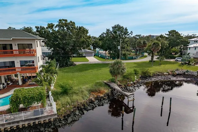 a view of a garden with a building in the background