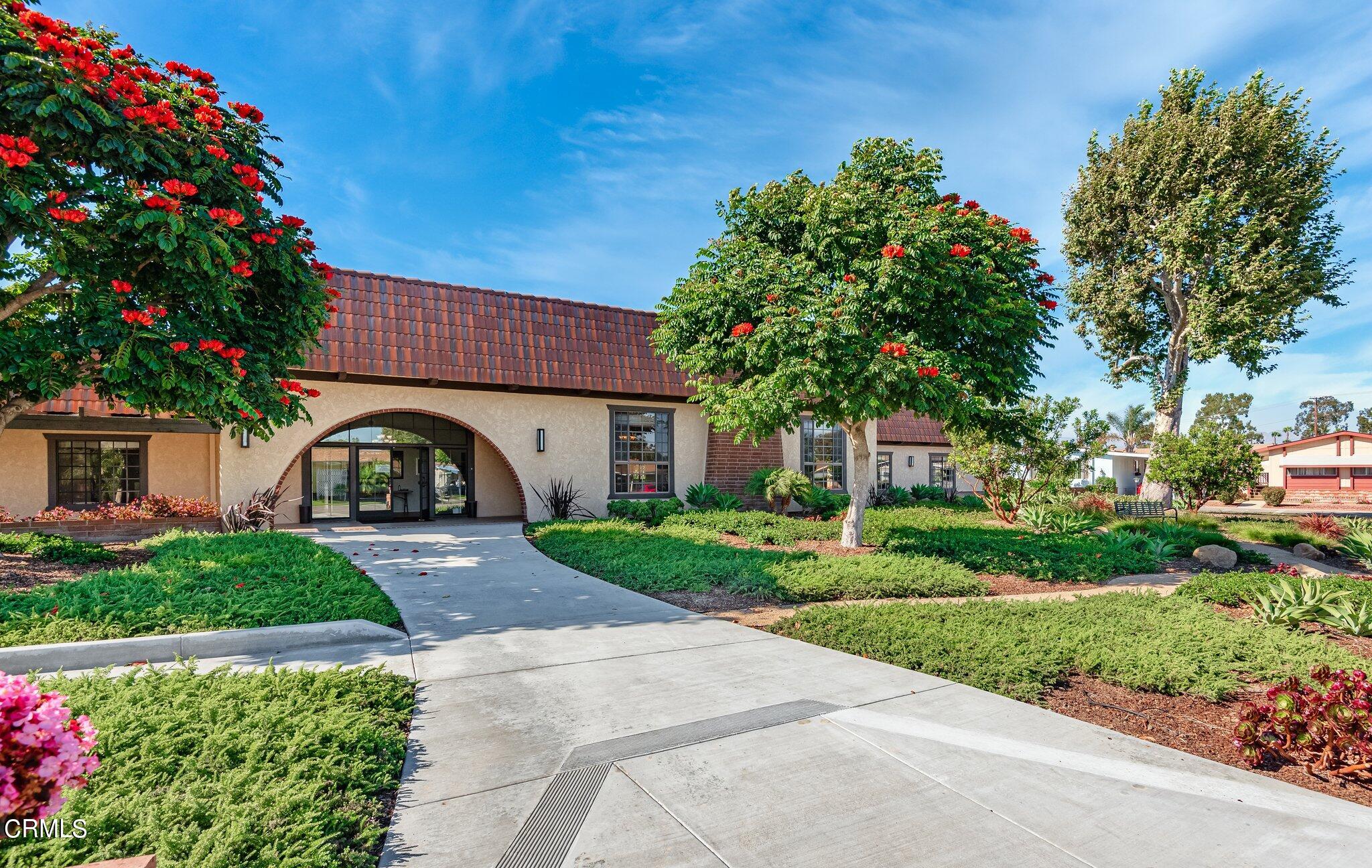 520 Raspberry Place, Unit 35 Oxnard, CA 93036 - Photo 24 of 27 a front view of a house with a garden
