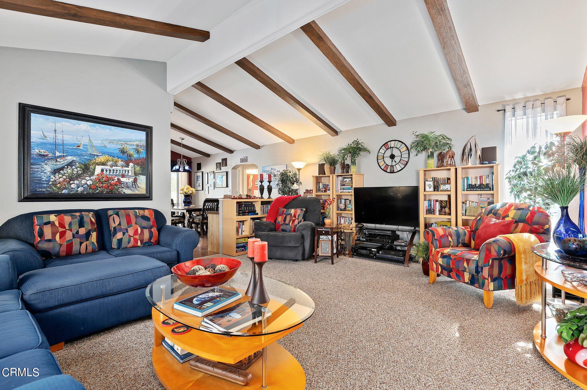 520 Raspberry Place, Unit 35 Oxnard, CA 93036 - Photo 4 of 27 a living room with furniture and a flat screen tv