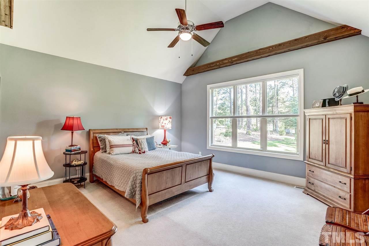 14010 Durant Road Raleigh, NC 27614 - Photo 19 of 30 a bedroom with a bed and a window
