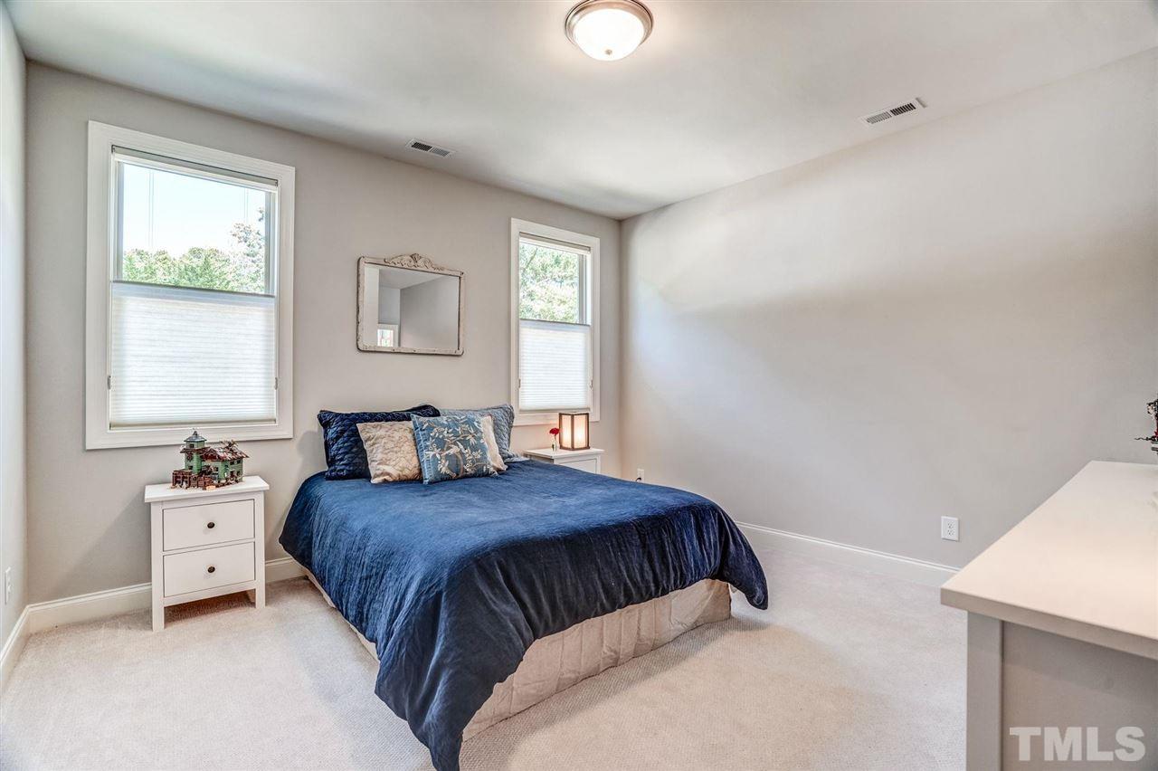 14010 Durant Road Raleigh, NC 27614 - Photo 23 of 30 a bedroom with a bed and a window