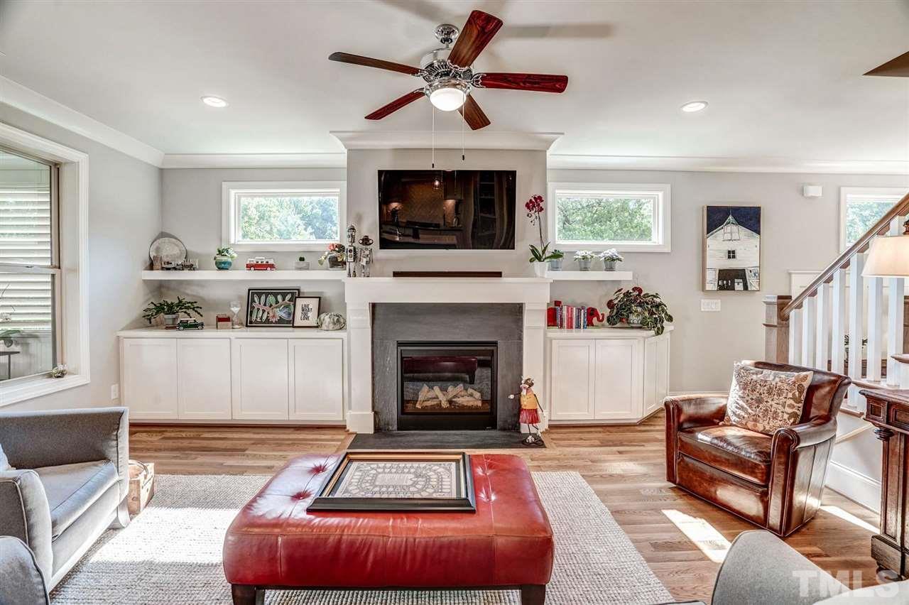 14010 Durant Road Raleigh, NC 27614 - Photo 10 of 30 a living room with furniture and a fireplace