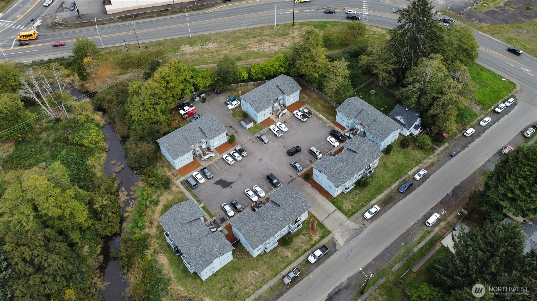 an aerial view of a house with a yard