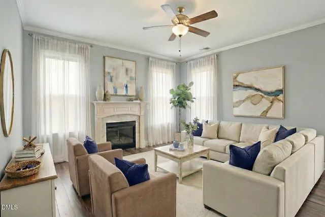 a living room with furniture and a fireplace
