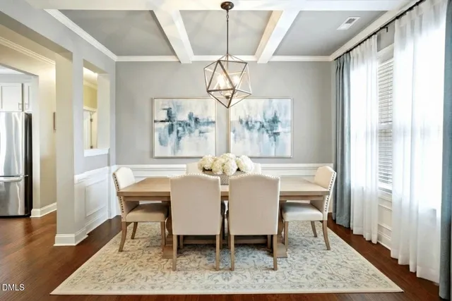 a view of a hallway with wooden floor and windows