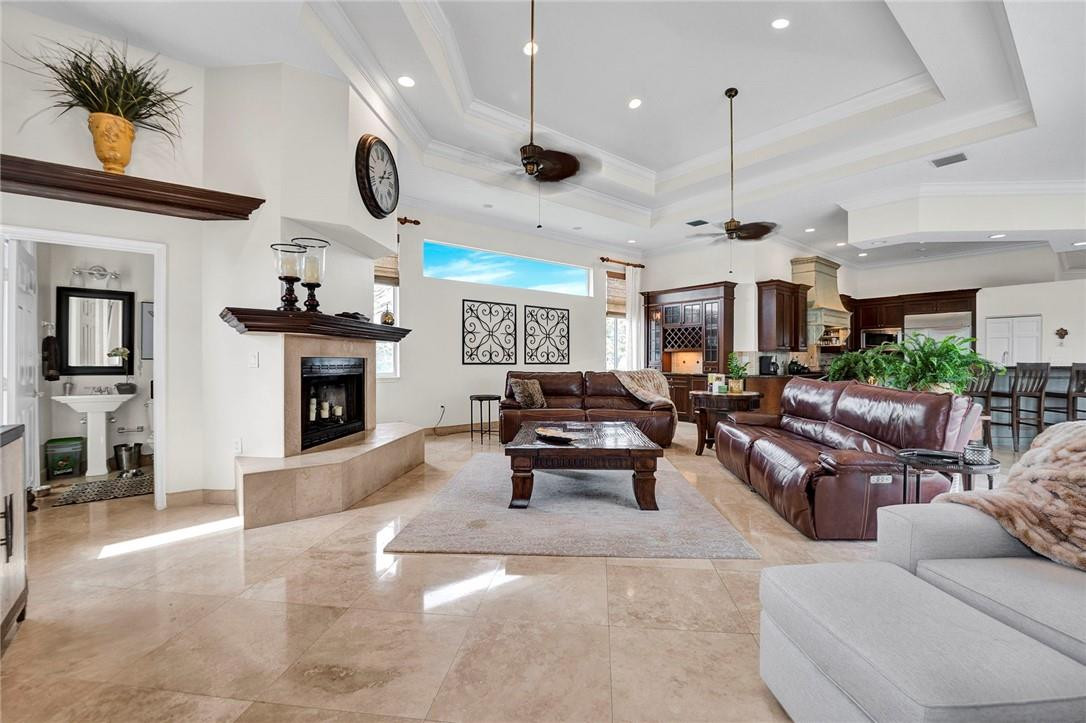 20240 Southwest 51st Court Southwest Ranches, FL 33332 - Photo 29 of 60 a living room with furniture and a fireplace