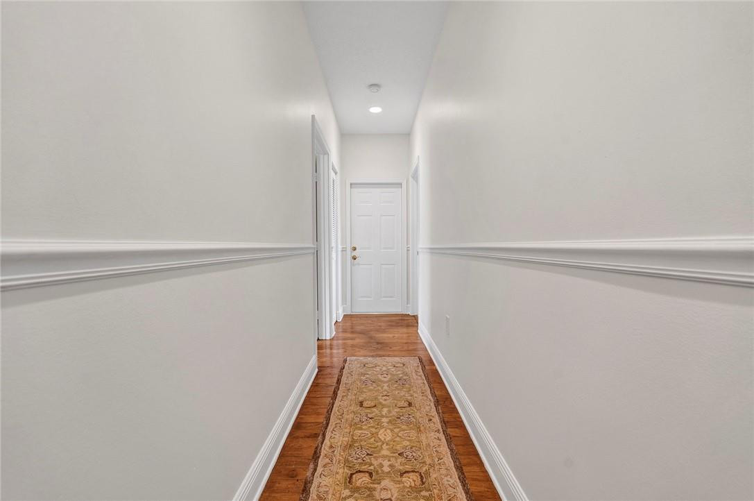 20240 Southwest 51st Court Southwest Ranches, FL 33332 - Photo 44 of 60 a view of a hallway with wooden floor and closet