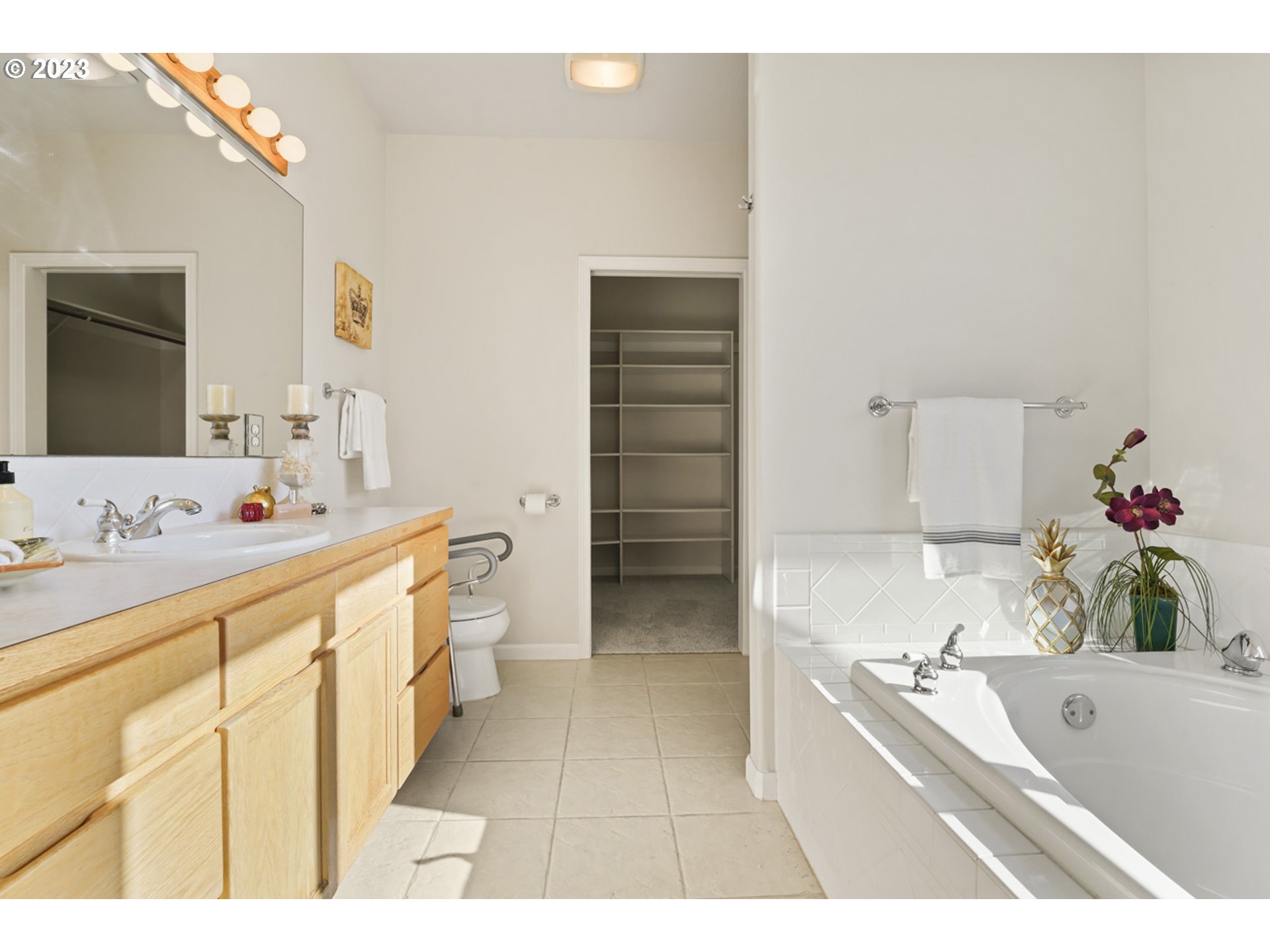 2920 Adams Street Eugene, OR 97405 - Photo 17 of 38 a bathroom with a tub sink and mirror
