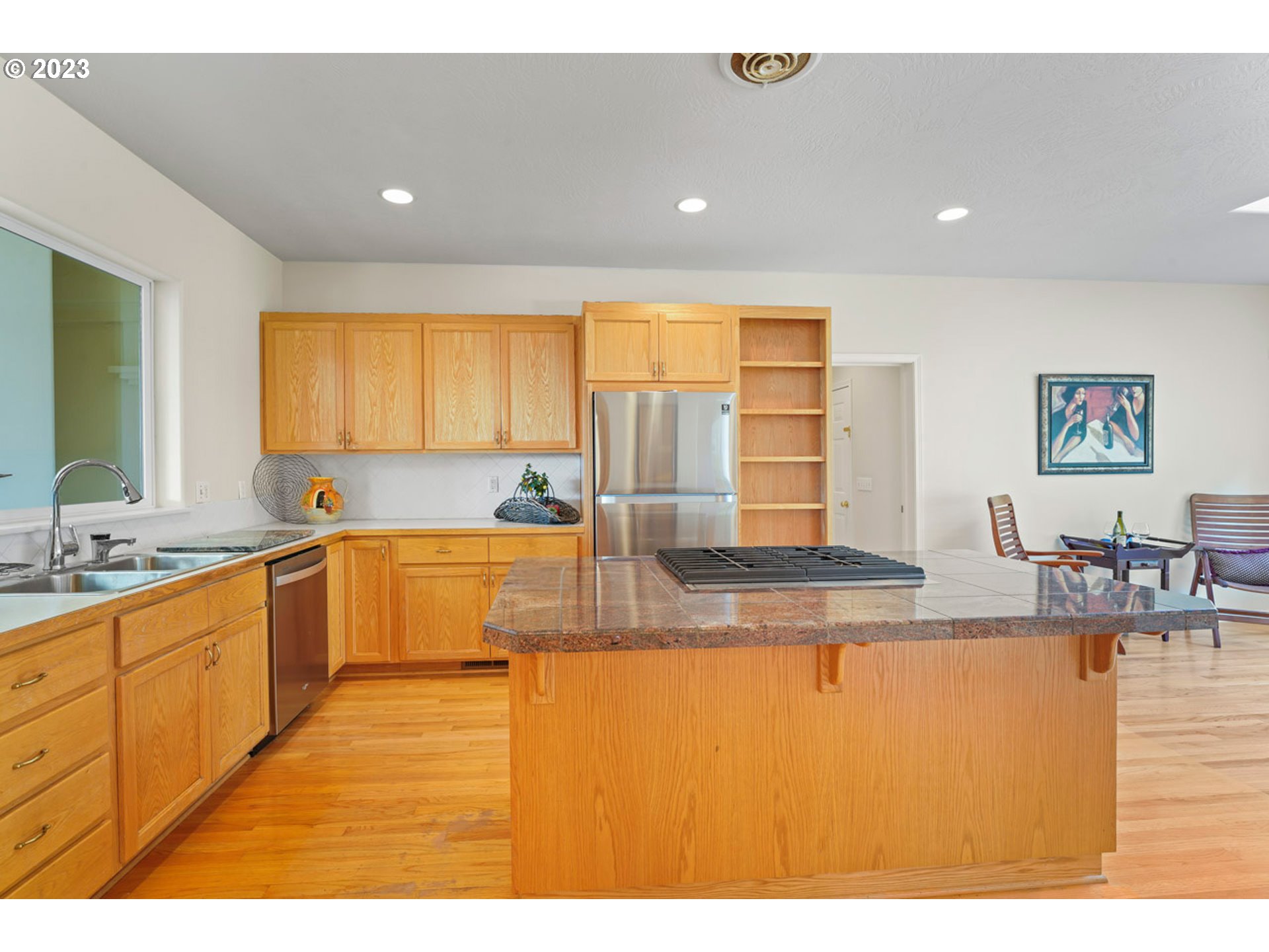 2920 Adams Street Eugene, OR 97405 - Photo 9 of 38 a large kitchen with stainless steel appliances granite countertop a sink and cabinets