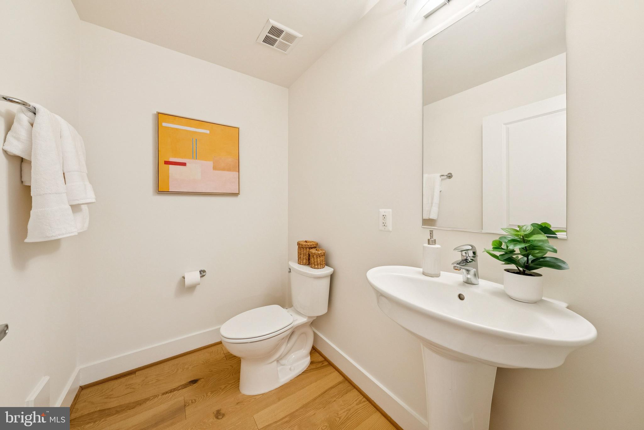 1209 13th Street Northwest, Unit 209 Washington, DC 20005 - Photo 11 of 16 a bathroom with a sink and a mirror