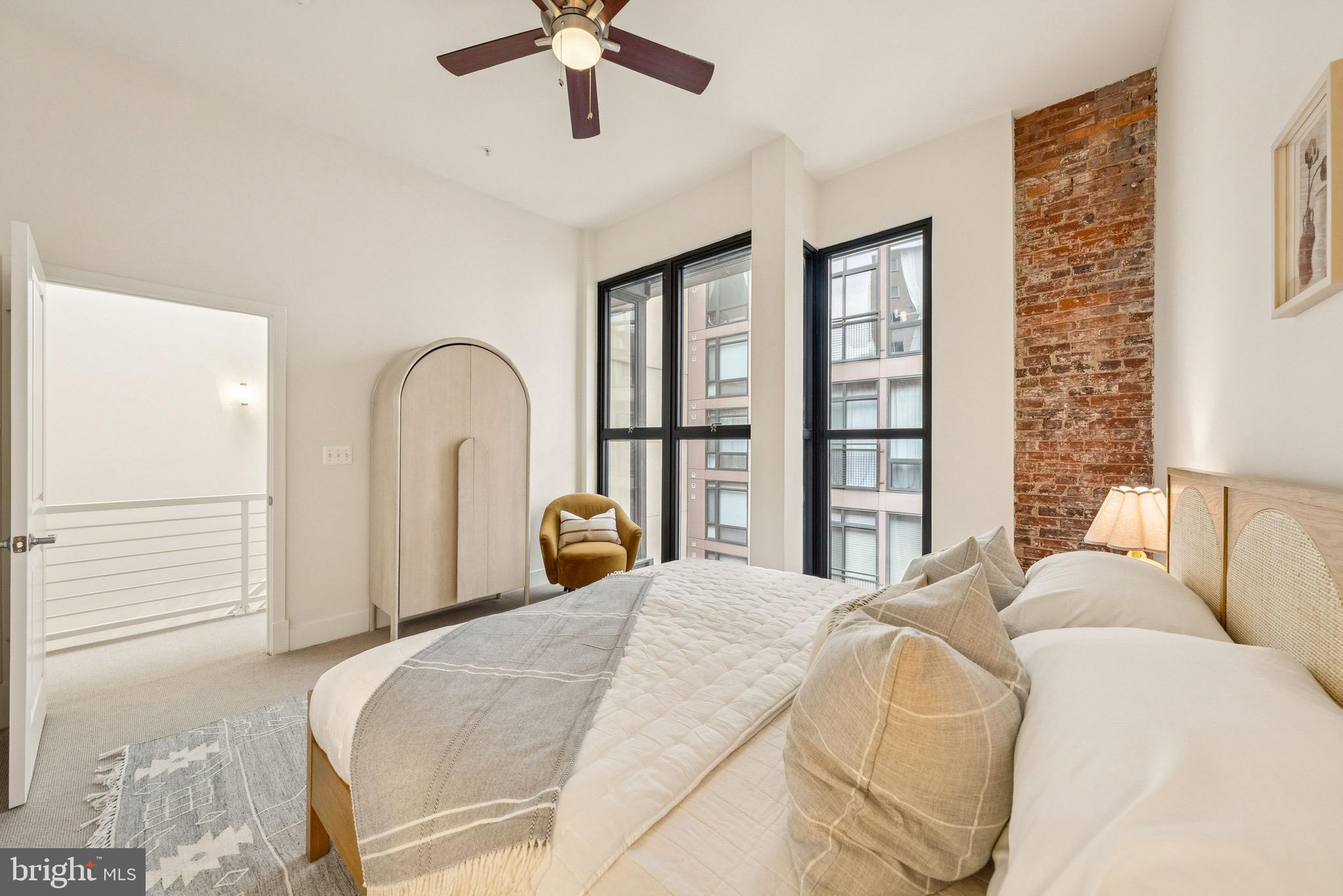 1209 13th Street Northwest, Unit 209 Washington, DC 20005 - Photo 13 of 16 a bedroom with bed and a large window