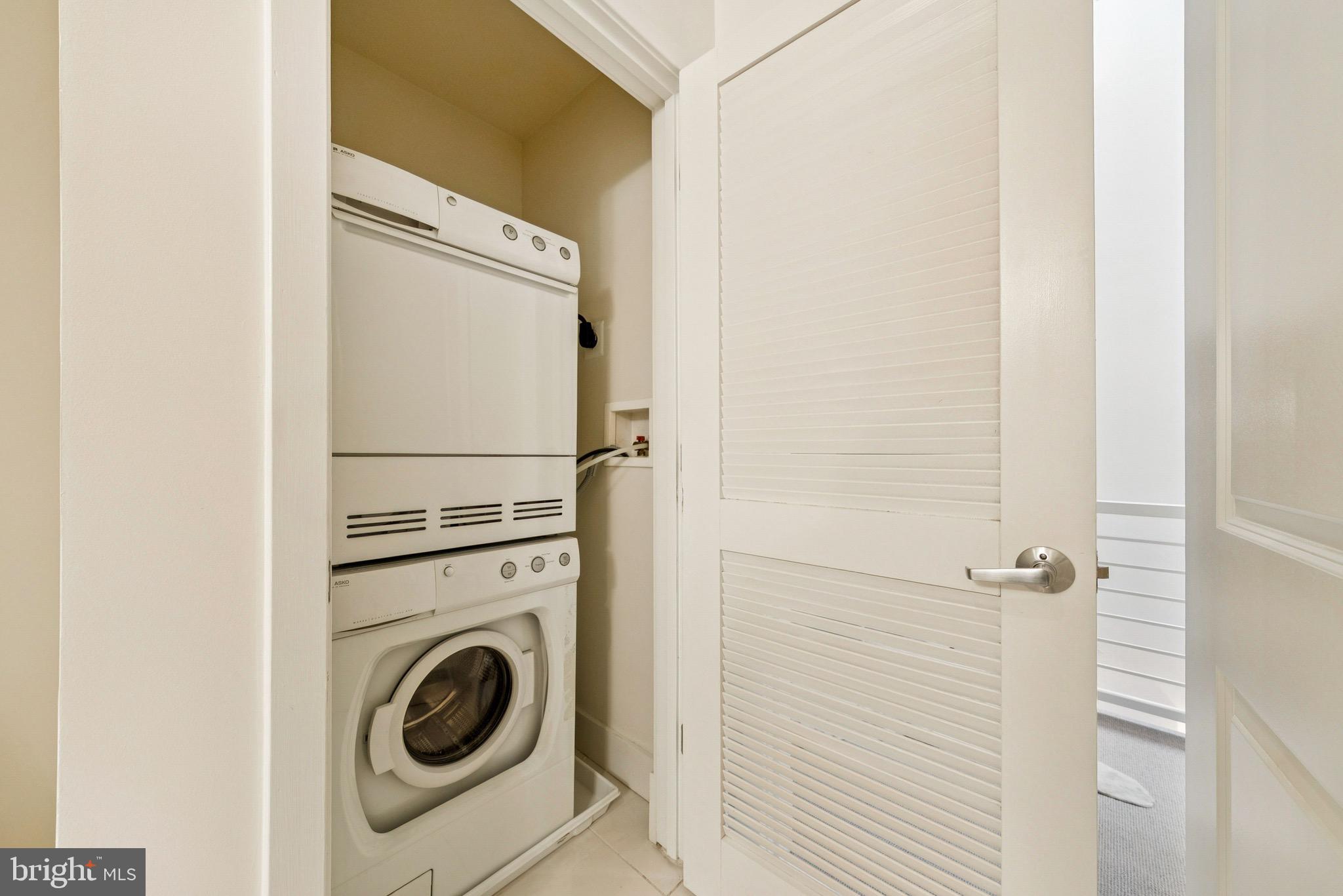 1209 13th Street Northwest, Unit 209 Washington, DC 20005 - Photo 15 of 16 a utility room with dryer and washer