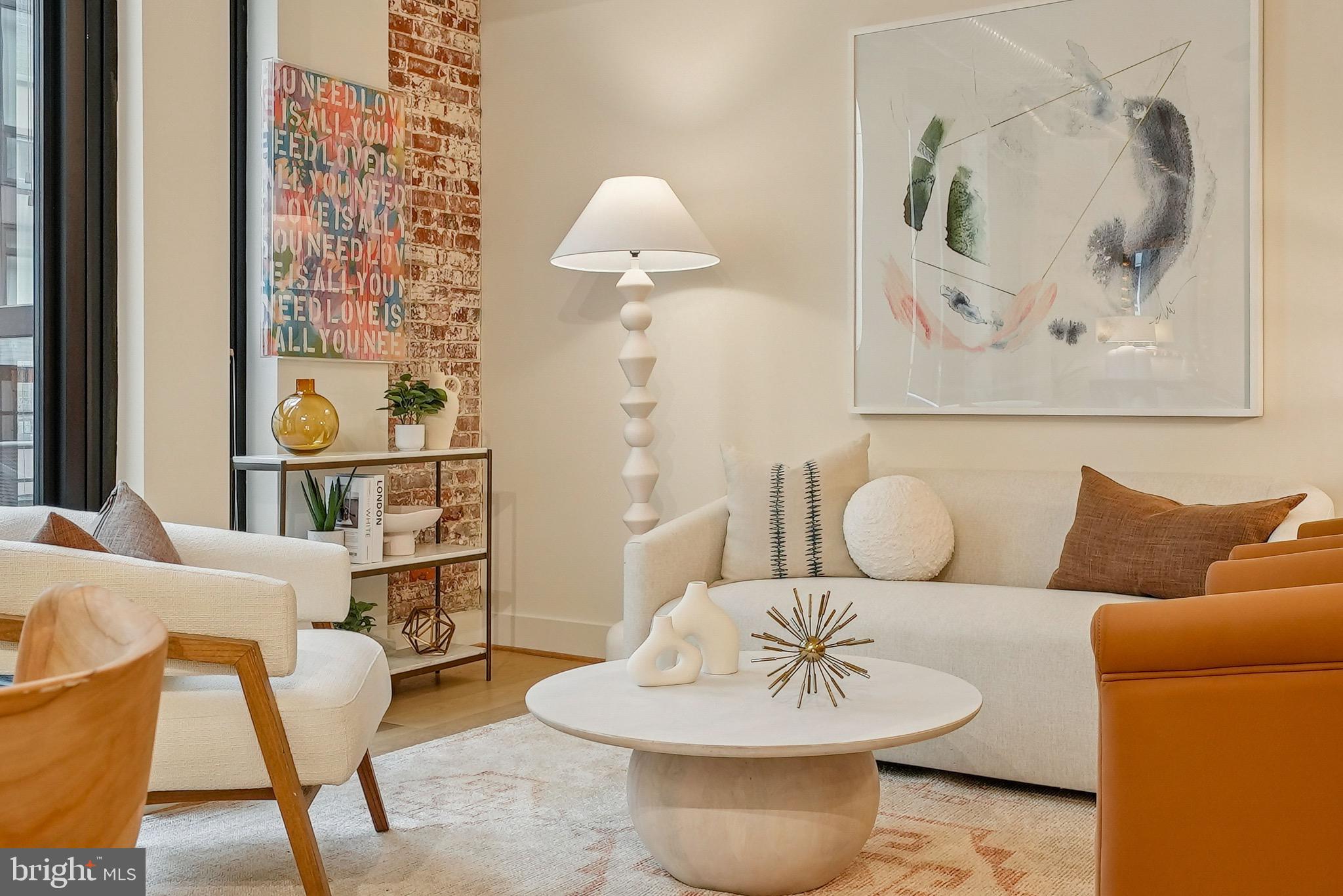 1209 13th Street Northwest, Unit 209 Washington, DC 20005 - Photo 3 of 16 a living room with furniture and a painting