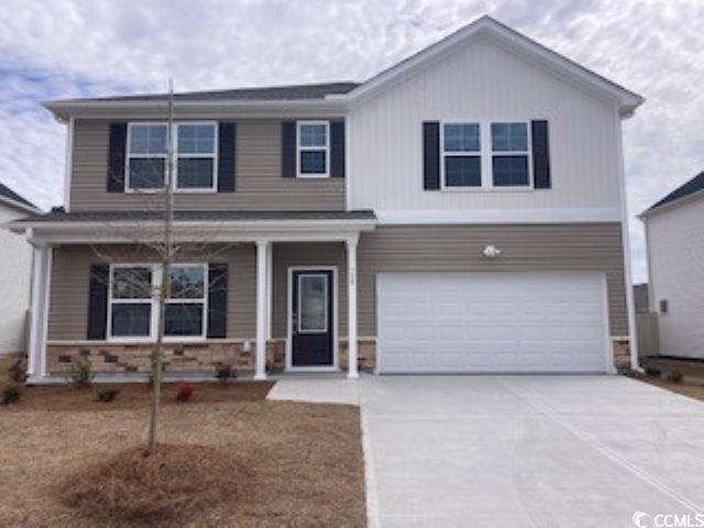 View of front of home with covered porch, concrete