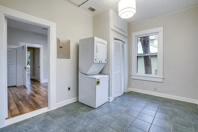 wooden floor in a en suite bathroom next to a window