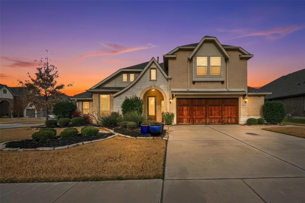 1421 Nighthawk Lane Mansfield, TX 76063 - Photo 1 of 40 a front view of a house with a yard