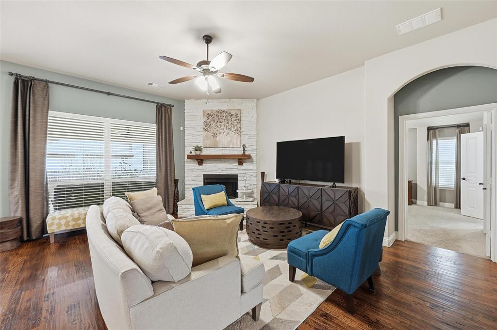 1421 Nighthawk Lane Mansfield, TX 76063 - Photo 14 of 40 a living room with furniture and a flat screen tv