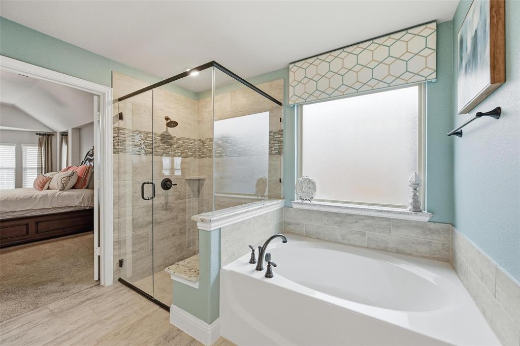 1421 Nighthawk Lane Mansfield, TX 76063 - Photo 23 of 40 a bathroom with a tub shower and sink