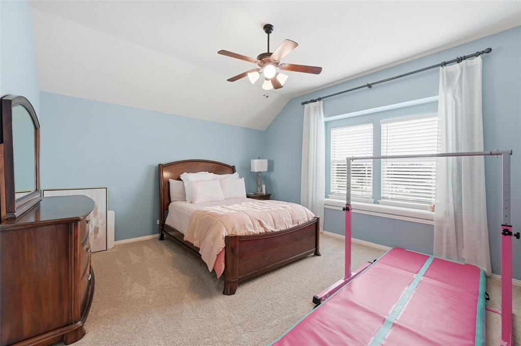 1421 Nighthawk Lane Mansfield, TX 76063 - Photo 31 of 40 a bedroom with a large bed and a window