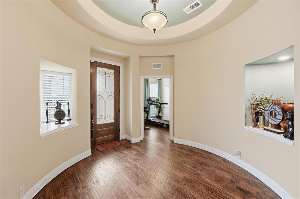 1421 Nighthawk Lane Mansfield, TX 76063 - Photo 4 of 40 wooden floor in an empty room with a window