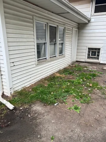 a backyard of a house with lots of green space