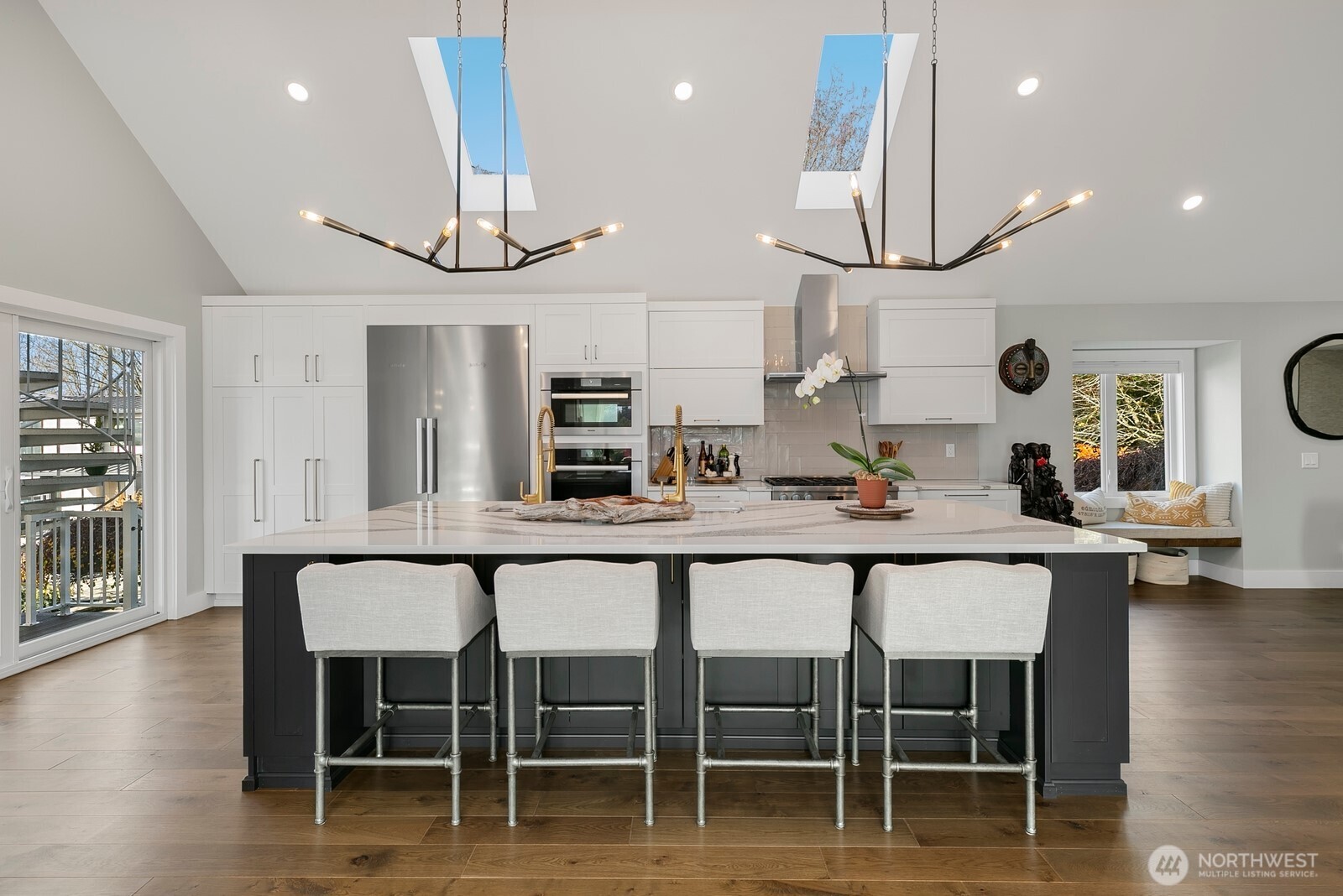 6625 136th Place Southwest Edmonds, WA 98026 - Photo 11 of 40 a kitchen with stainless steel appliances a dining table chairs and wooden floor