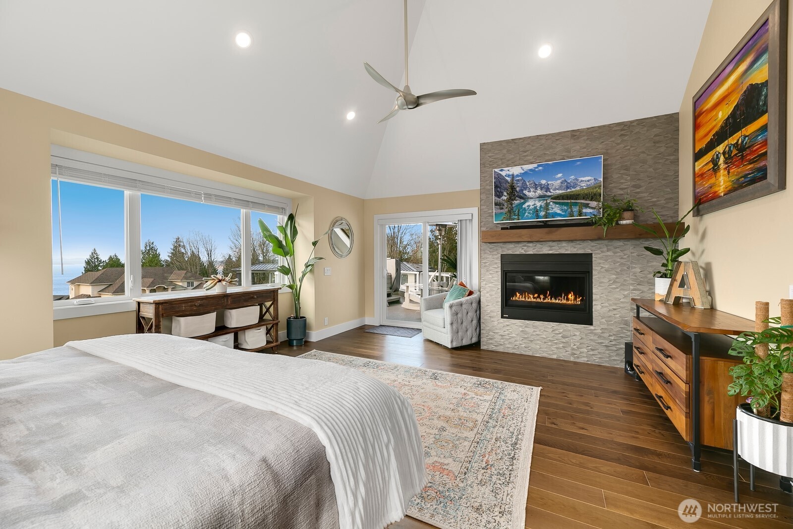 6625 136th Place Southwest Edmonds, WA 98026 - Photo 21 of 40 a spacious bedroom with a bed and a fireplace