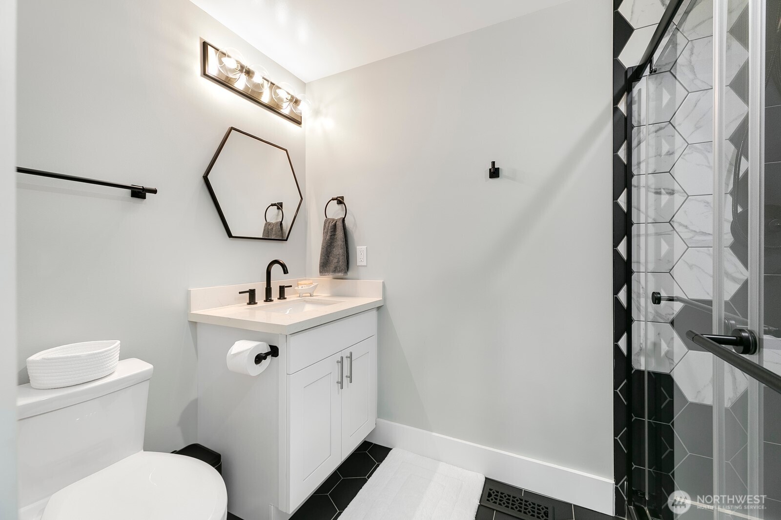 6625 136th Place Southwest Edmonds, WA 98026 - Photo 30 of 40 a bathroom with a toilet sink and mirror