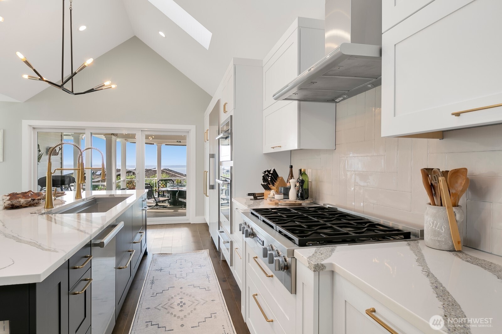 6625 136th Place Southwest Edmonds, WA 98026 - Photo 9 of 40 a kitchen with stainless steel appliances granite countertop a sink stove and cabinets