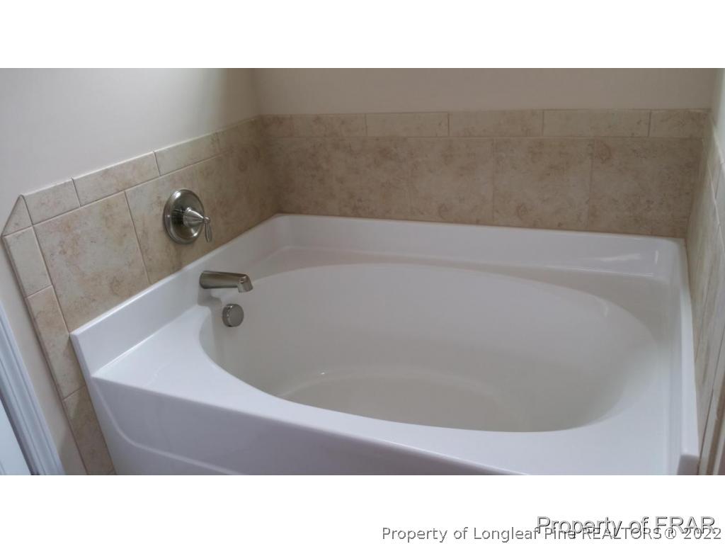 157 Shellbark Drive Spring Lake, NC 28390 - Photo 12 of 17 a bathroom with a bathtub