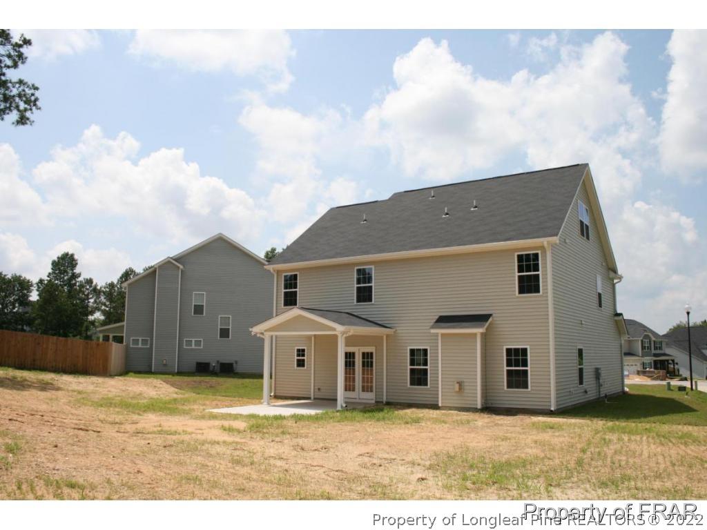 157 Shellbark Drive Spring Lake, NC 28390 - Photo 15 of 17 a view of a yard in front of a house with wooden fence